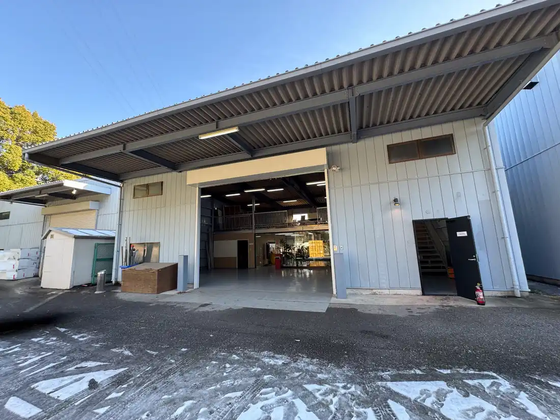 The Warehouse from outside, drive-in door open